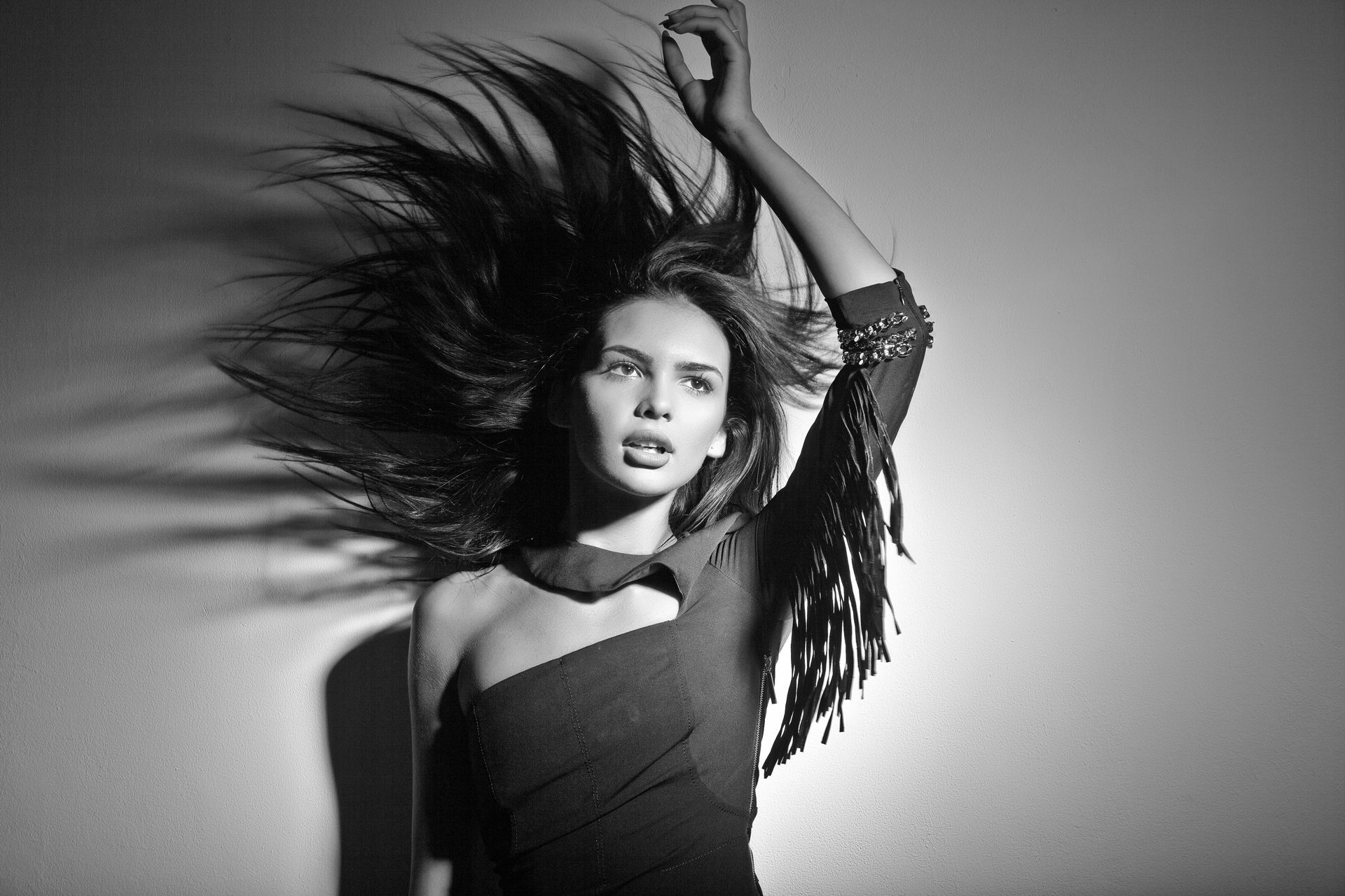 A woman with her hair blowing in the wind