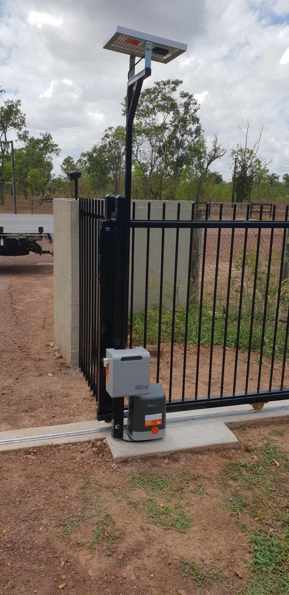 A Sliding Gate With a Solar Panel on Top of It — Fence Factory In Berrimah, NT
