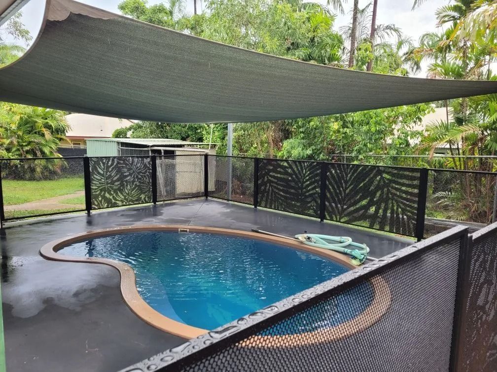 A Swimming Pool With a Fence and a Canopy Over It — Fence Factory In Berrimah, NT