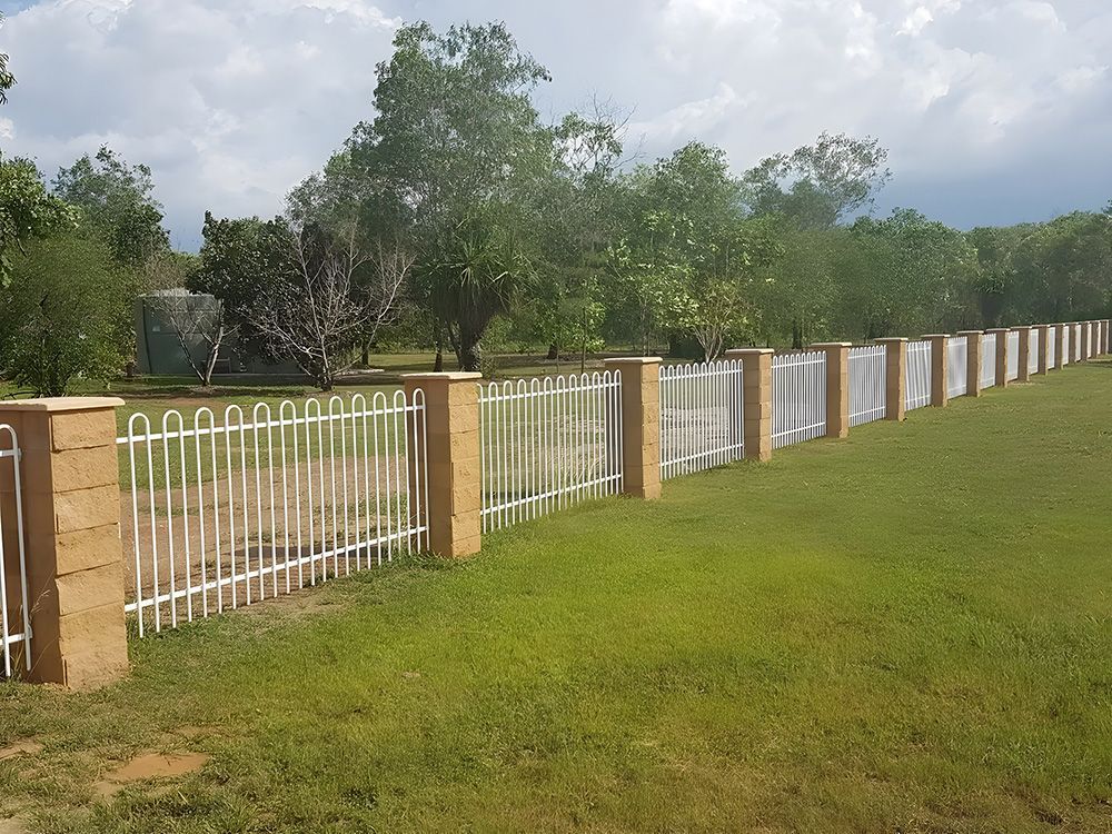 White Metal Fence with Brick Pillars Borders