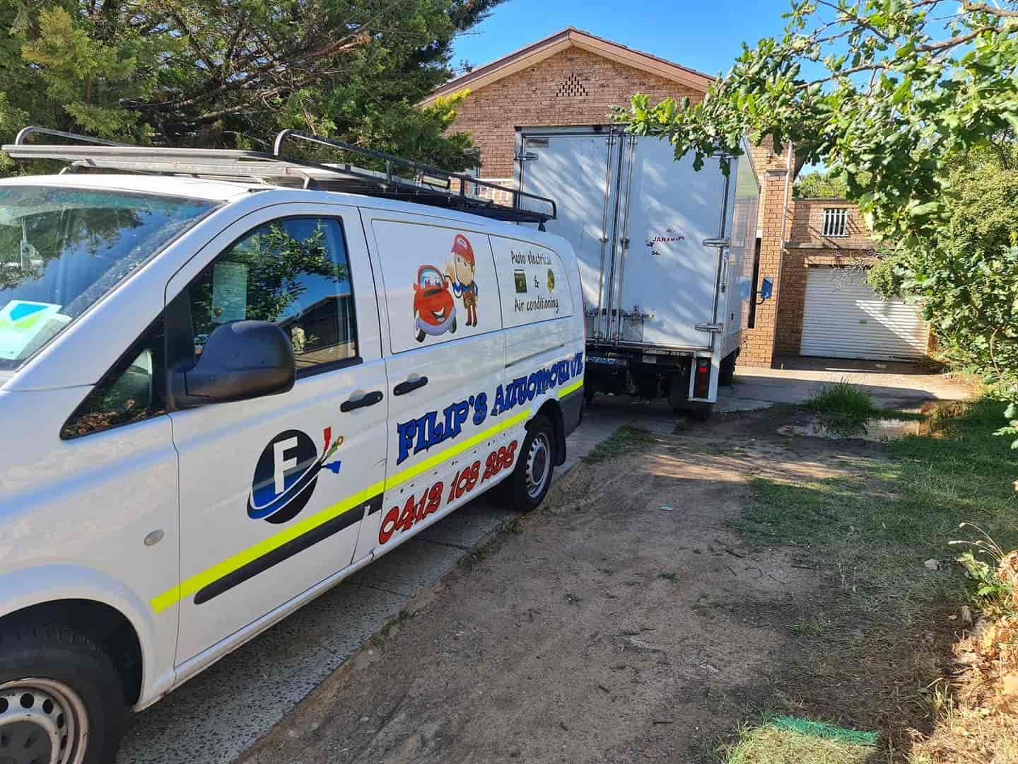 A White Van Is Parked In Front Of A House — Filip's Automotive in Crestwood, NSW