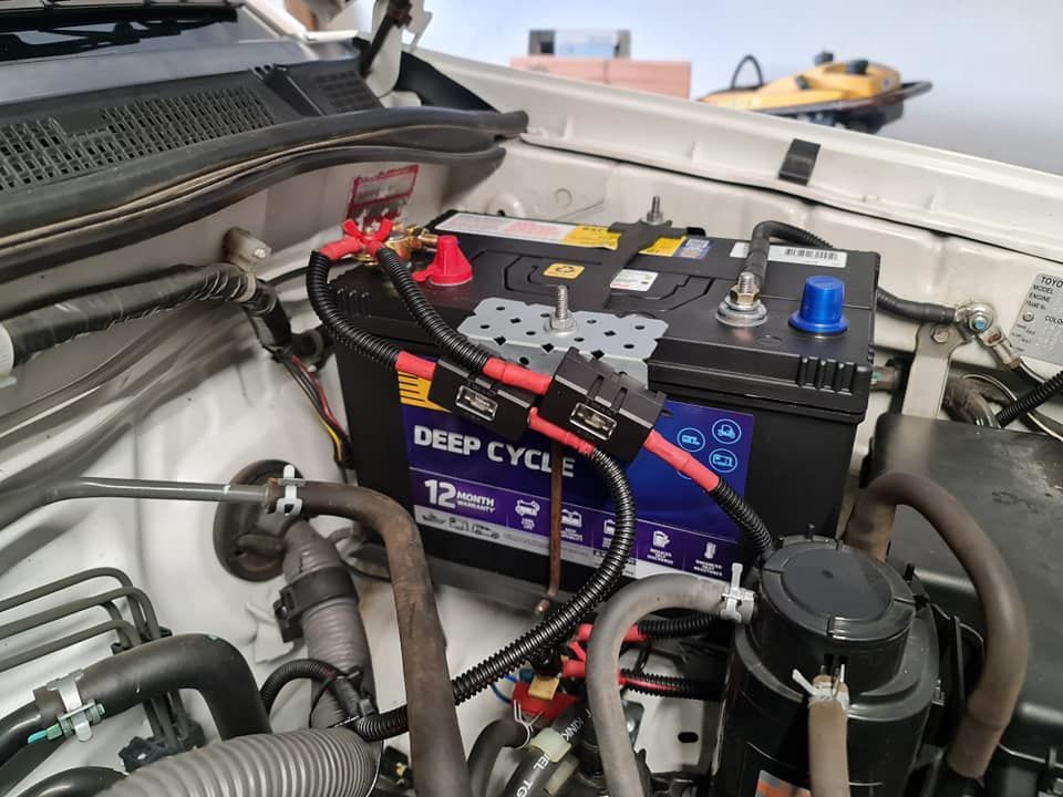 A Deep Cycle Battery Is Sitting Under The Hood Of A Car — Filip's Automotive in Crestwood, NSW