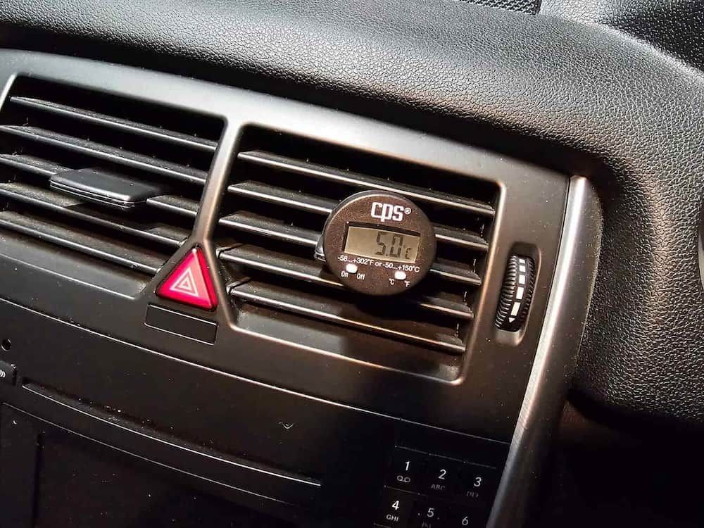 A Car Air Vent With A Digital Thermometer Attached — Filip's Automotive in Crestwood, NSW