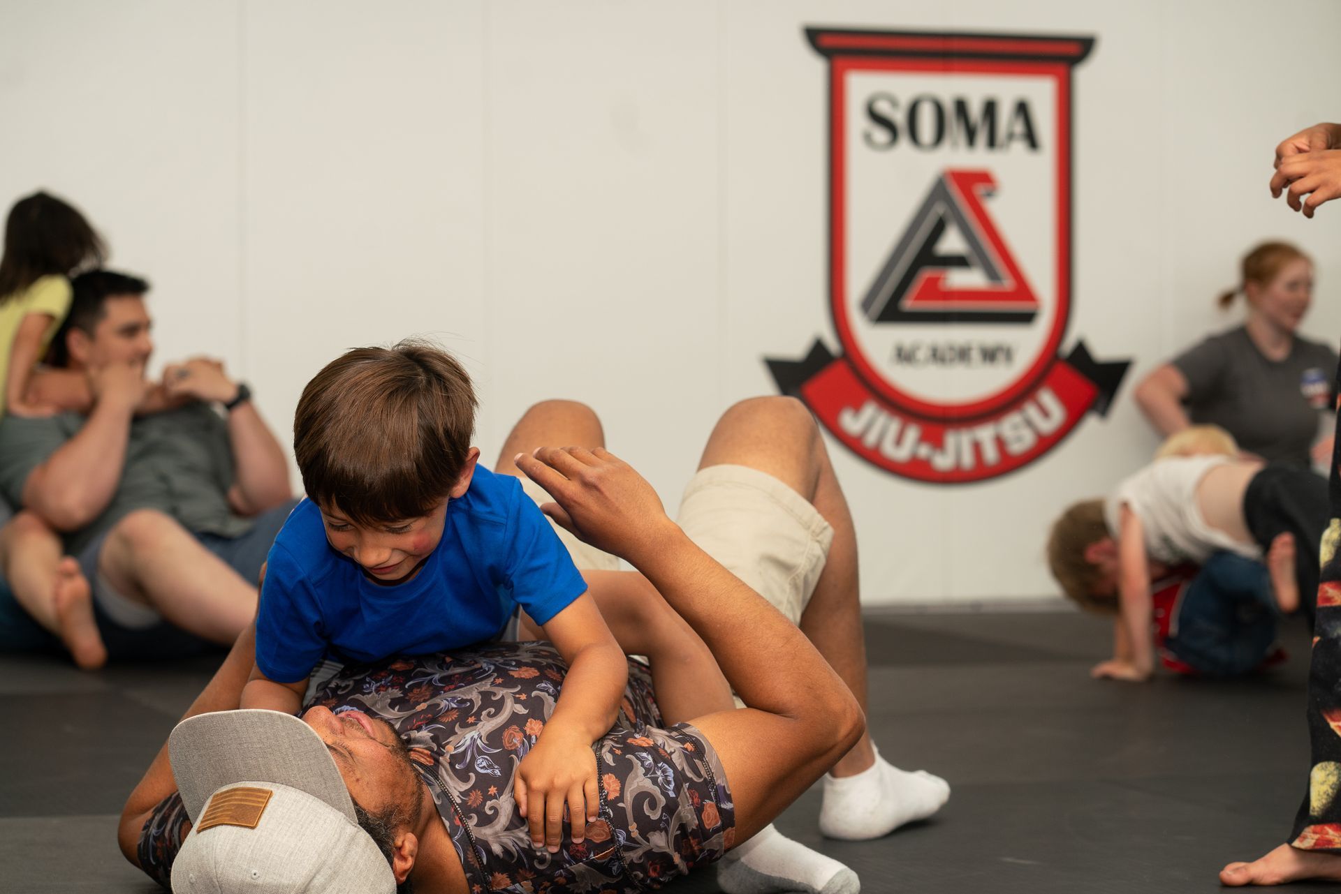 Students practicing Brazilian Jiu-Jitsu at Soma Jiu-Jitsu Rexburg to reduce stress.