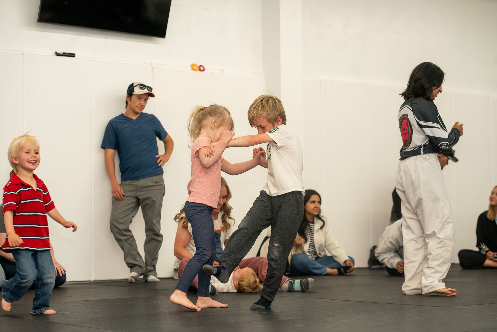 Families practicing Brazilian Jiu-Jitsu drills at Soma Jiu-Jitsu Academy in Rexburg, ID.