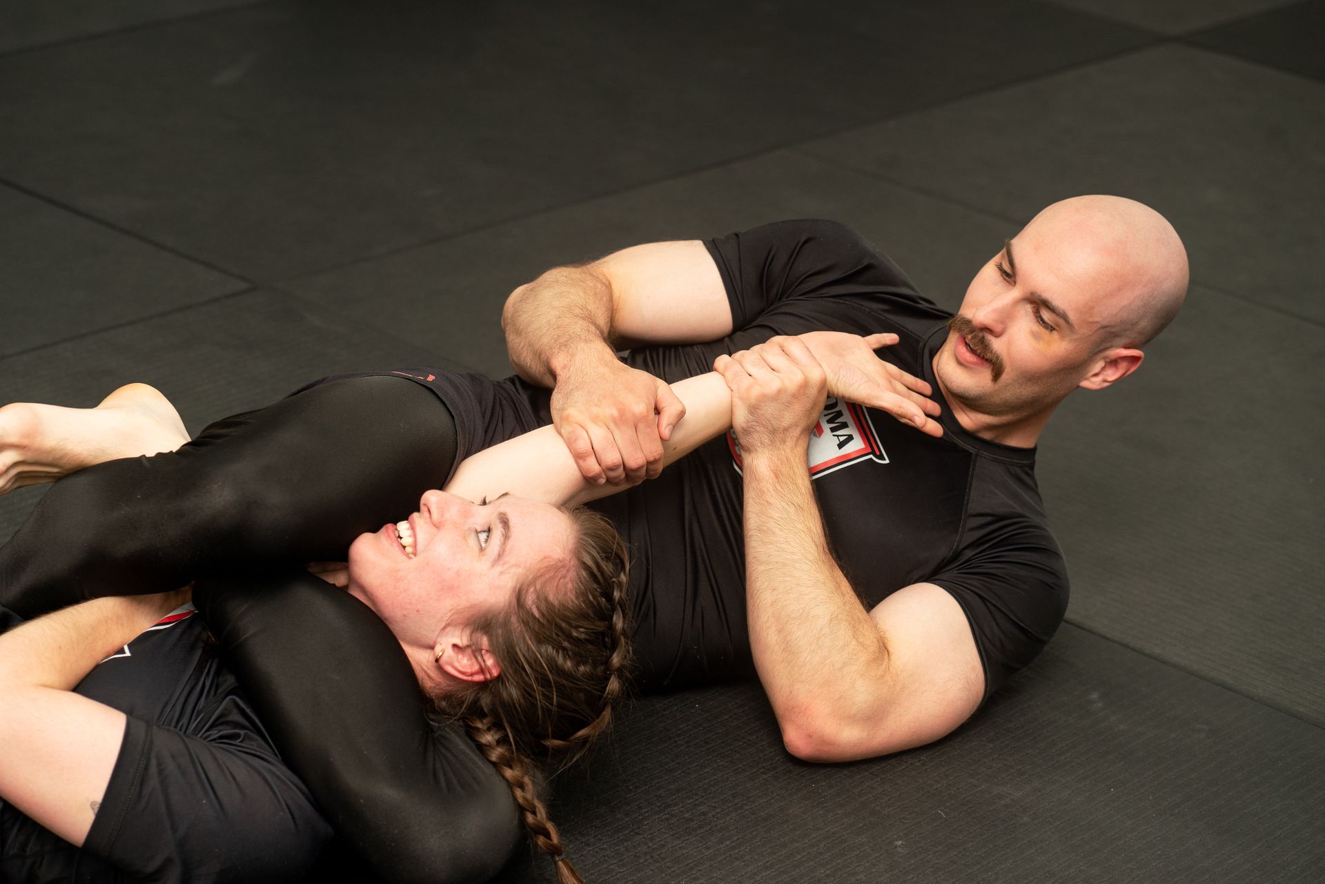 Students training Brazilian Jiu-Jitsu at Soma Jiu-Jitsu Academy in Rexburg, ID, building fitness.