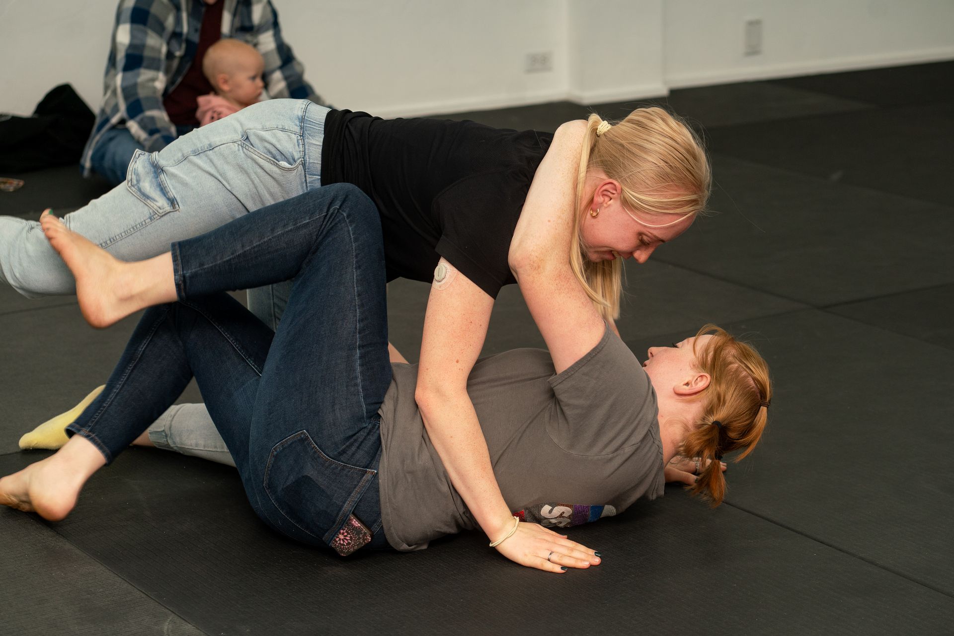 Adults practicing Brazilian Jiu-Jitsu at Soma Jiu-Jitsu Academy in Rexburg, ID, building focus and fitness.