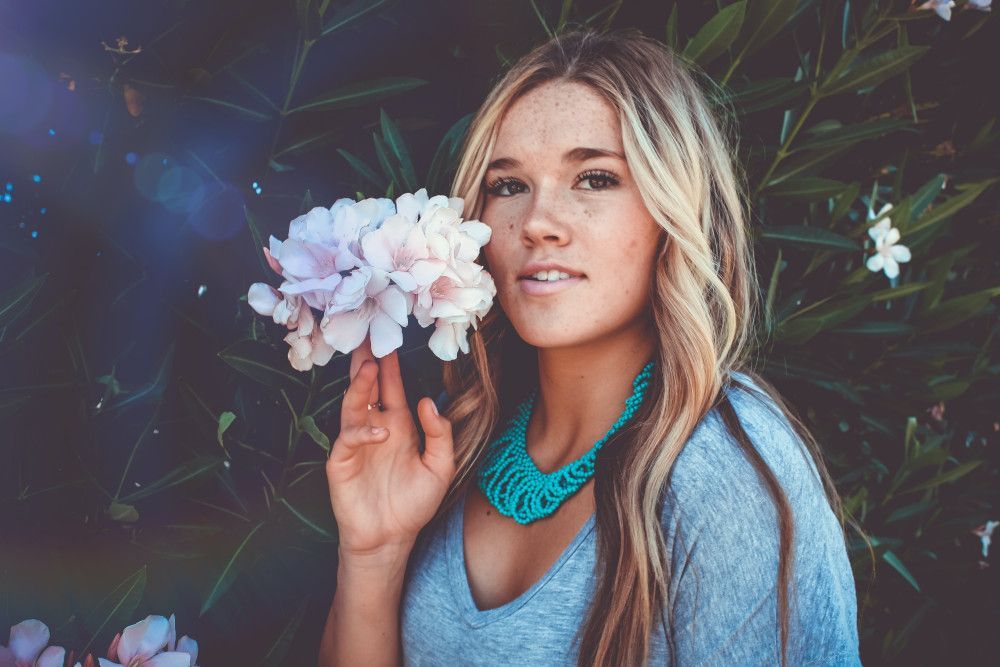 woman holding a flower