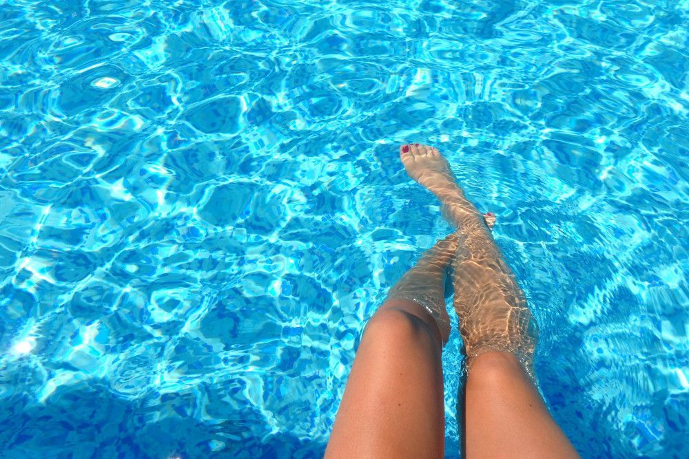 woman's legs in pool