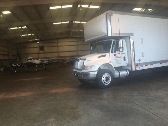 Auto Transport Company — White Delivery Truck in a Garage in Oneonta, AL