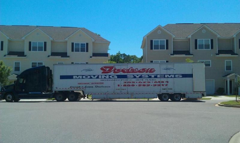 Residential Movers — Wide Moving Truck at Residential House in Oneonta, AL