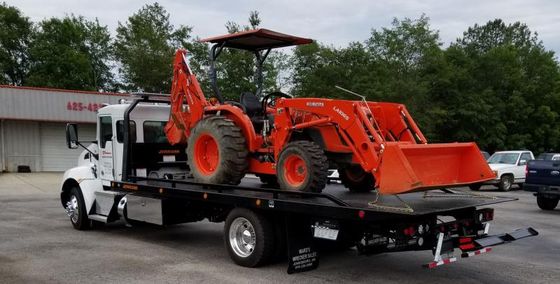 Moving Companies — White Truck With Front End Loader Machine in Oneonta, AL