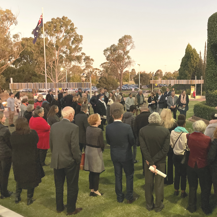 Artists, dignitaries and guests taking part in a smoking ceremony at the 2022 First Nations Art Exhibition