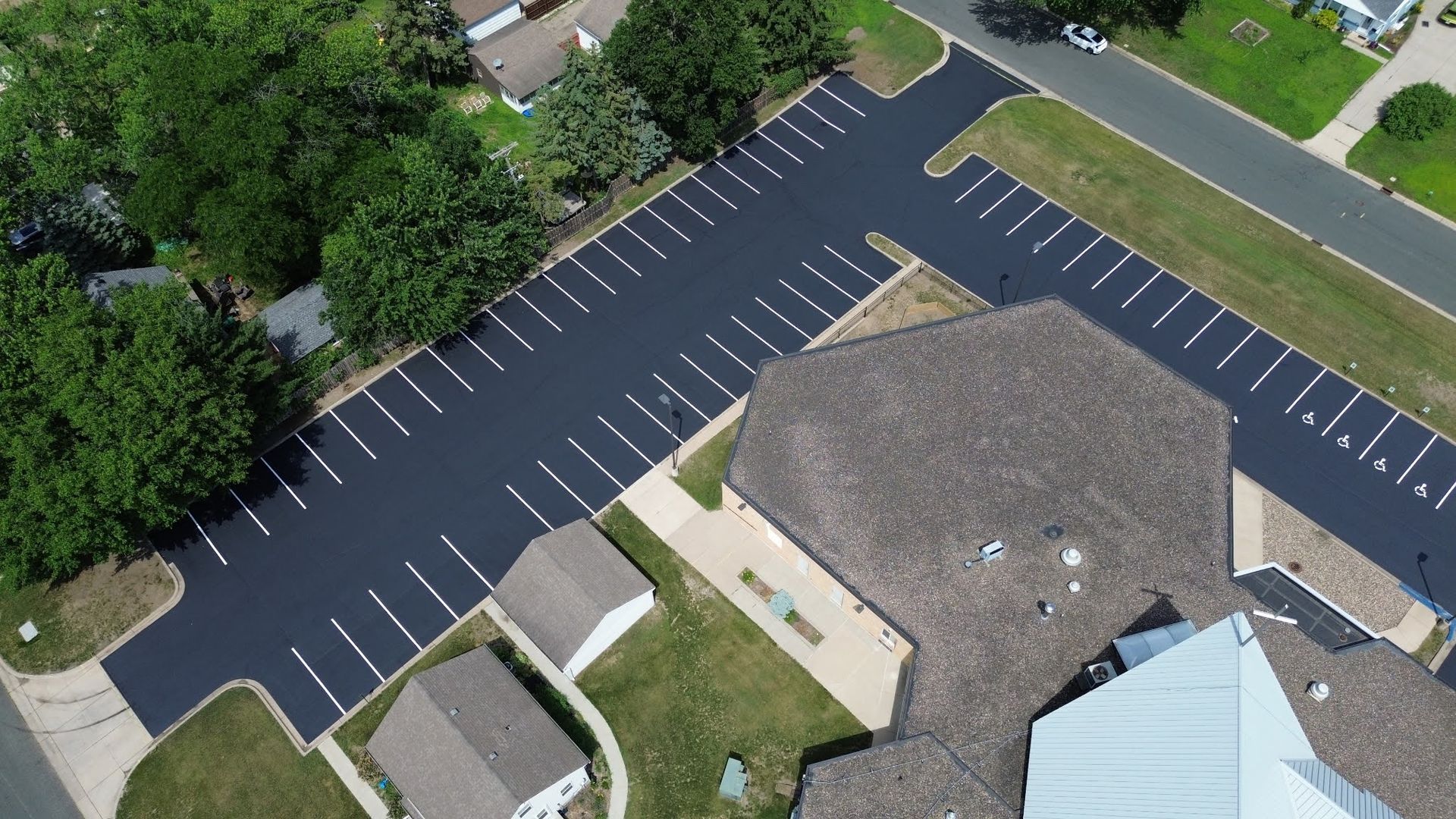A man is installing a hood in a kitchen.