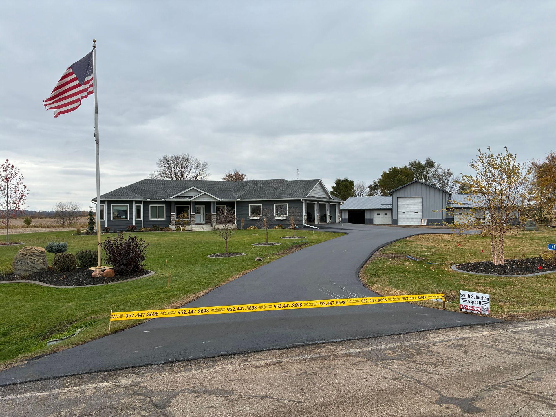 A dump truck is being loaded with dirt by a bulldozer.