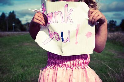 Little Girl Holding Thank You Note