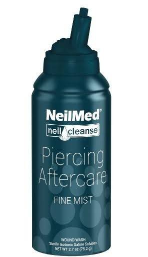 A bottle of neilmed piercing aftercare fine mist on a white background.