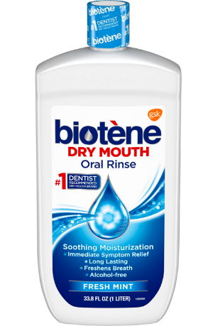 A bottle of biotene dry mouth oral rinse in fresh mint flavor.