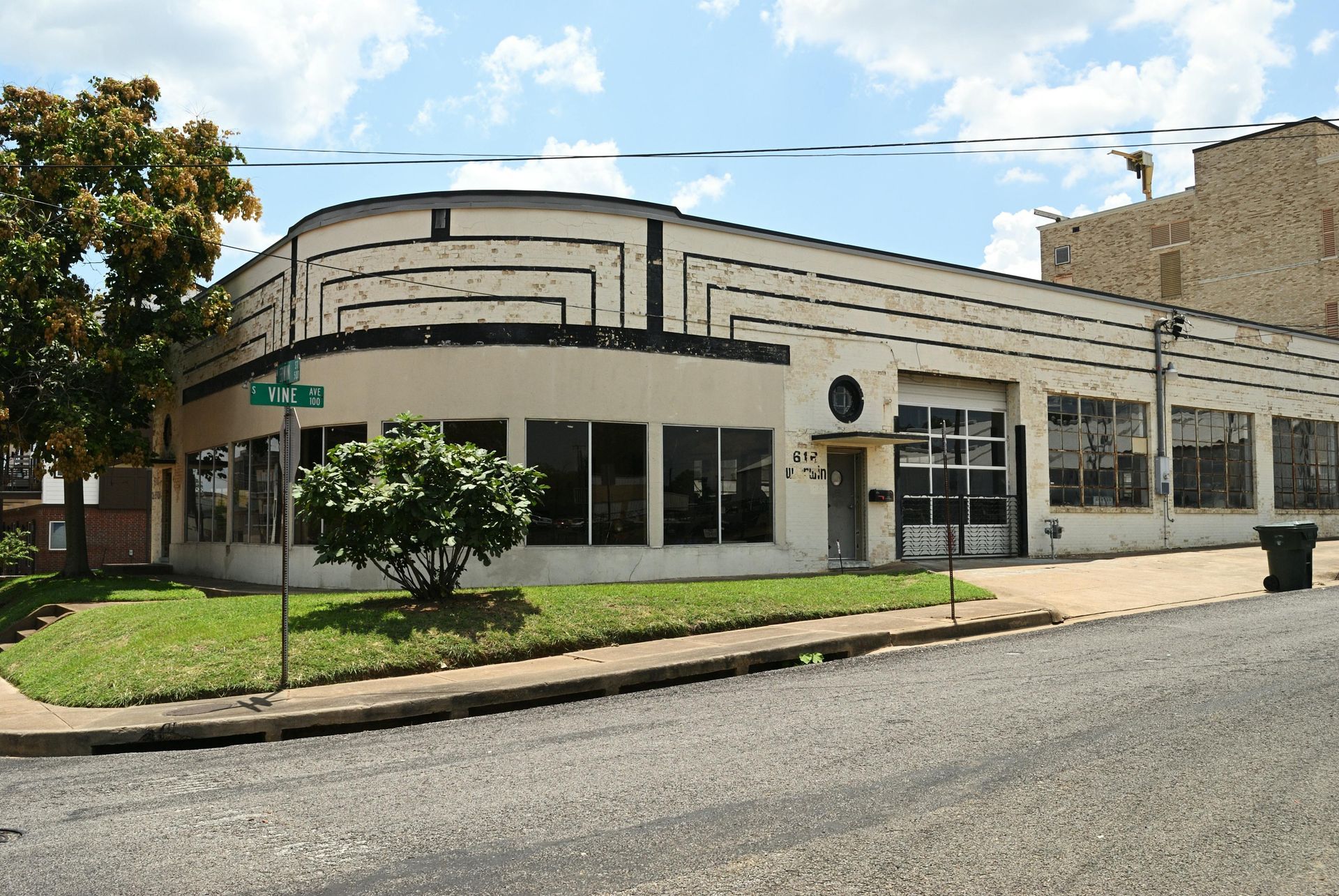 A building with a green street sign in front of it