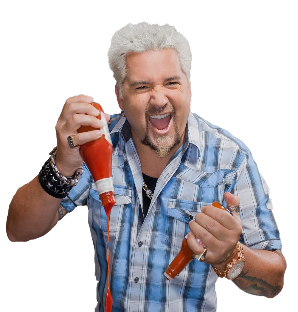 Smiling man with gray hair holding two red chili peppers, one near his mouth, against a white background