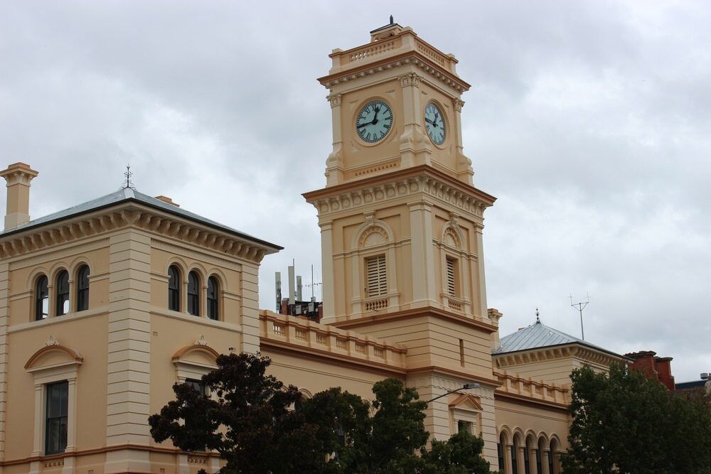 A Large Building With a Clock Tower on Top of It — Queanbeyan Auto Parts in Goulburn, NSW