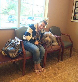 Dog and owner in veterinary hospital—Kaysville Veterinary Hospital in Kaysville, UT