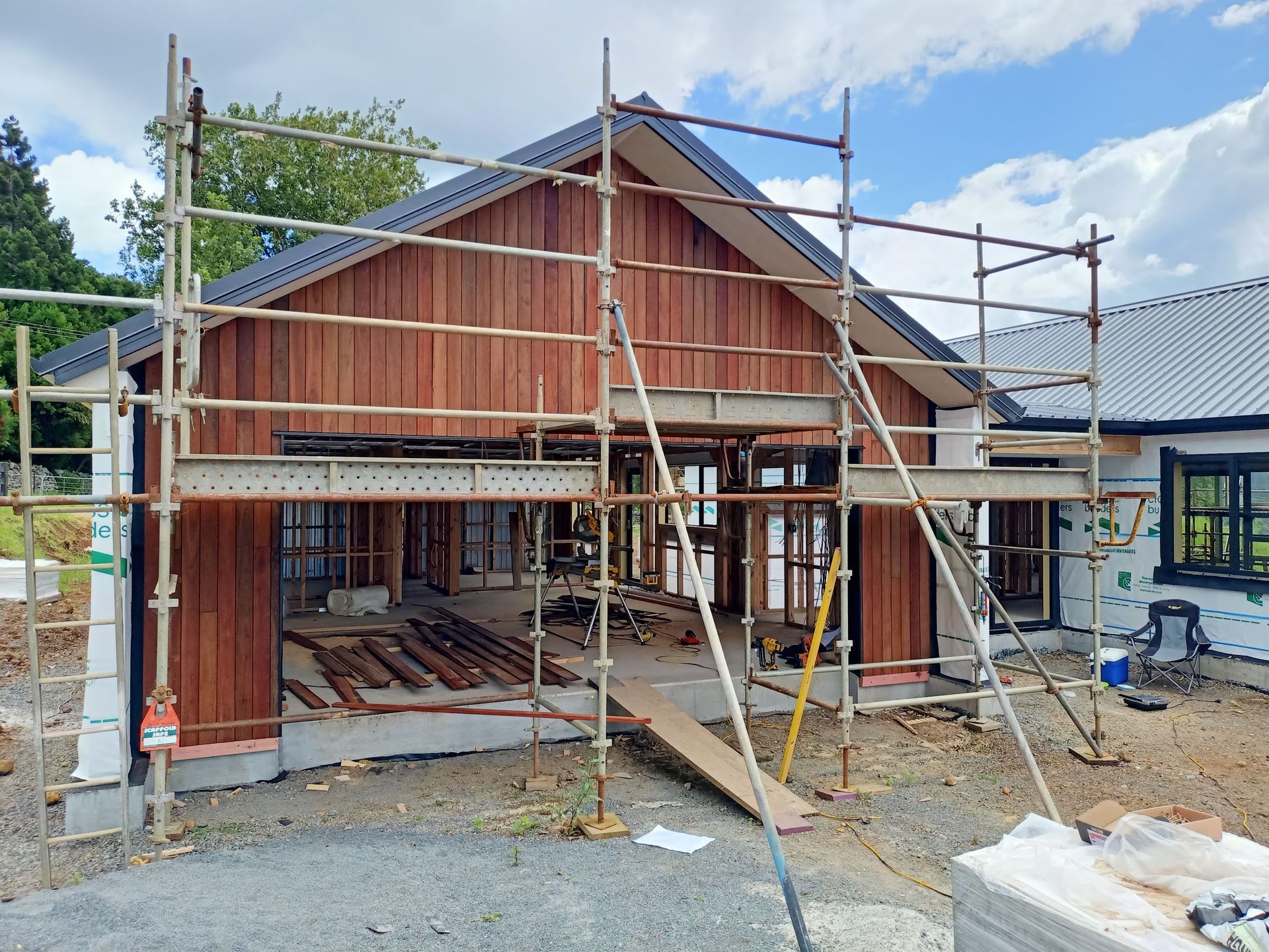A house is being built with scaffolding around it.