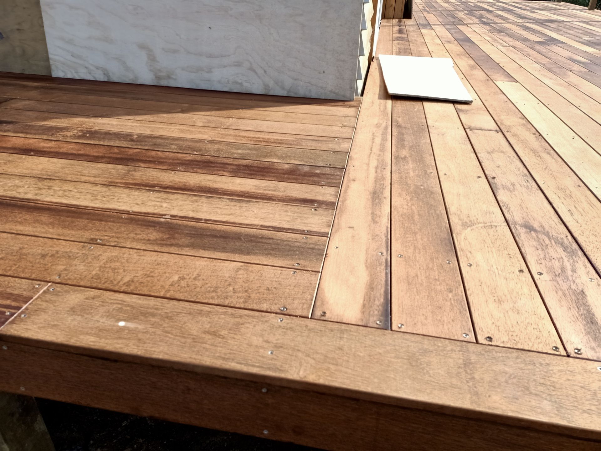 A wooden deck with a laptop on it