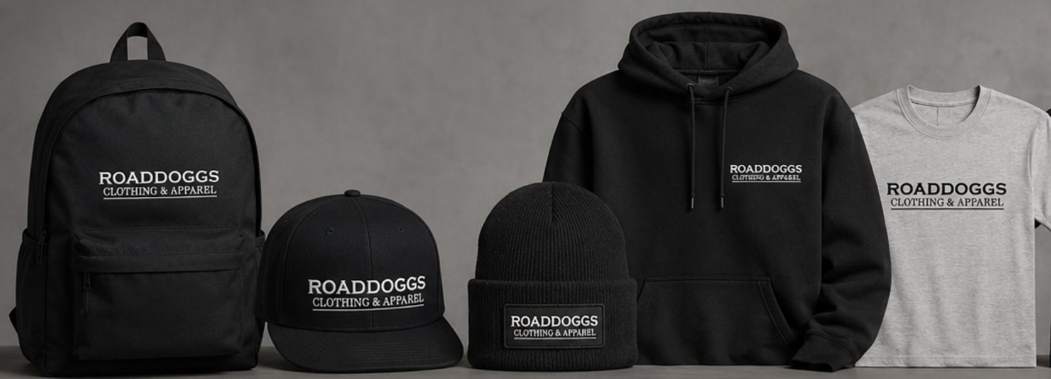 Assorted black, green, and burgundy hats, backpacks, and embroidered patches laid out on a beige surface