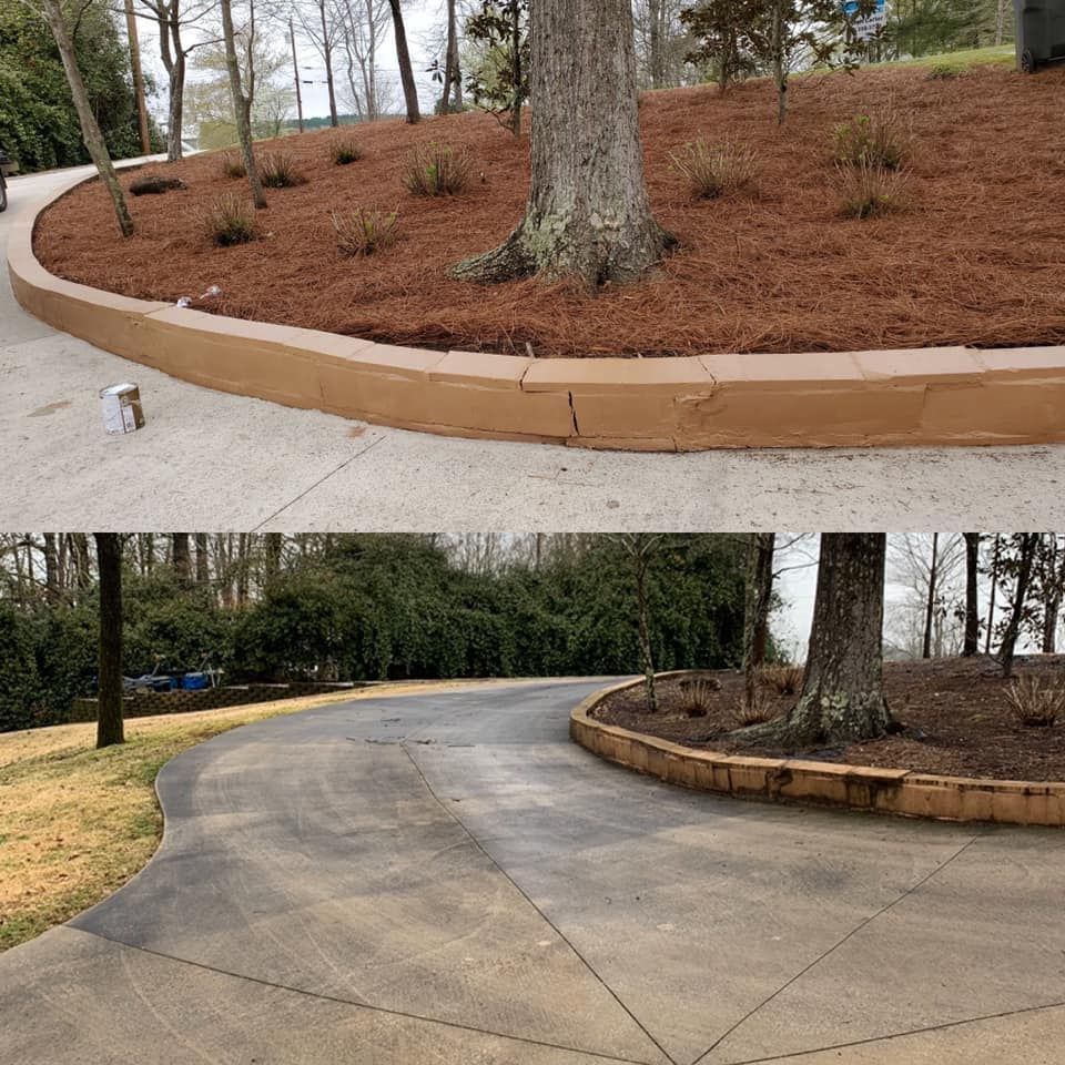 A large porch with wicker furniture and a vase of flowers.