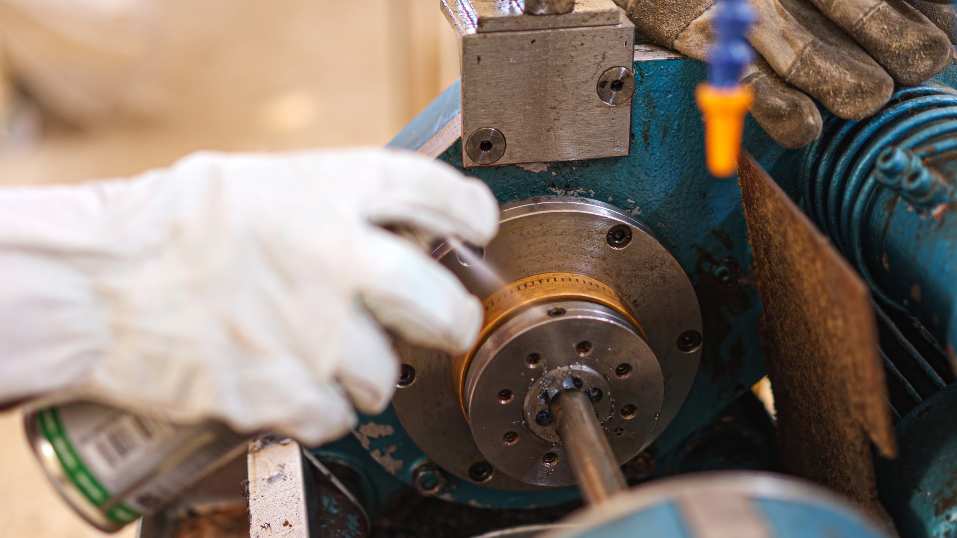 Glowing orange flames lick the sides of stacked refractory bricks in a dark industrial furnace setting.