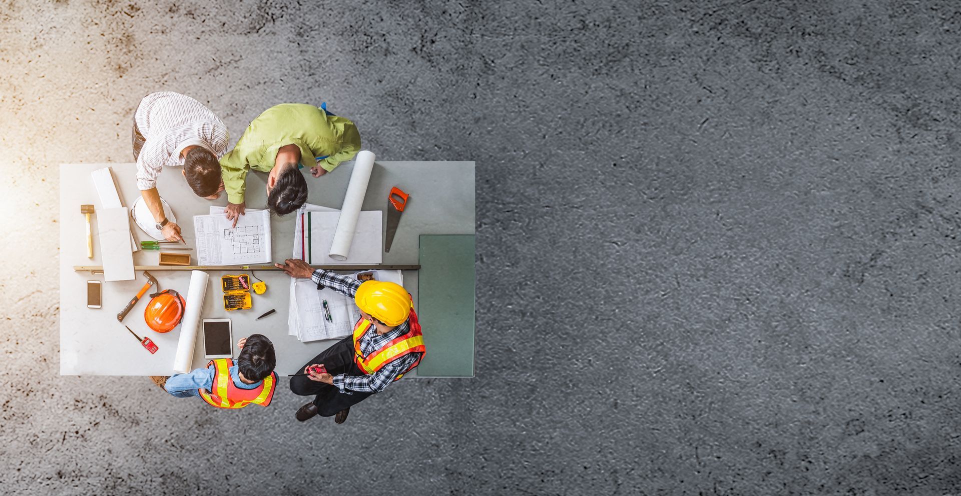 Group engineer and architects meeting at construction site, discussing.