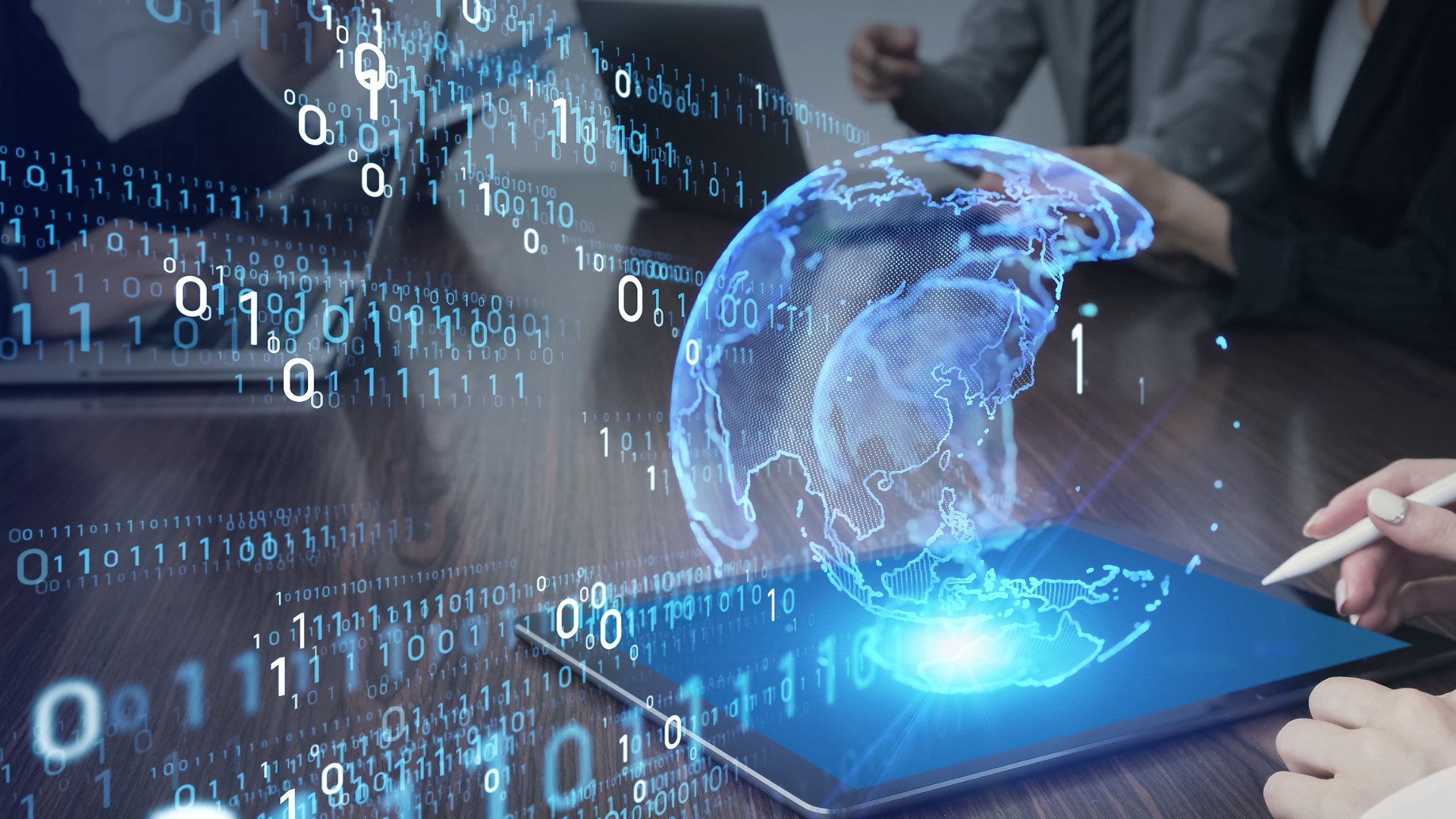 People at table, viewing digital world map hologram on tablet, surrounded by binary code.