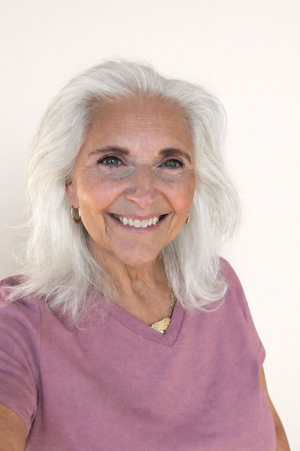 A person wearing a light blue polo shirt with a 