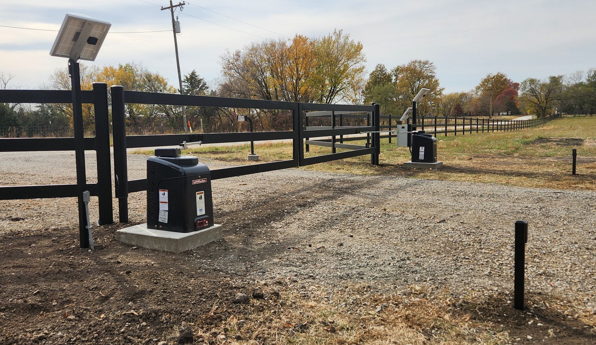 A fence with a solar panel on top of it
