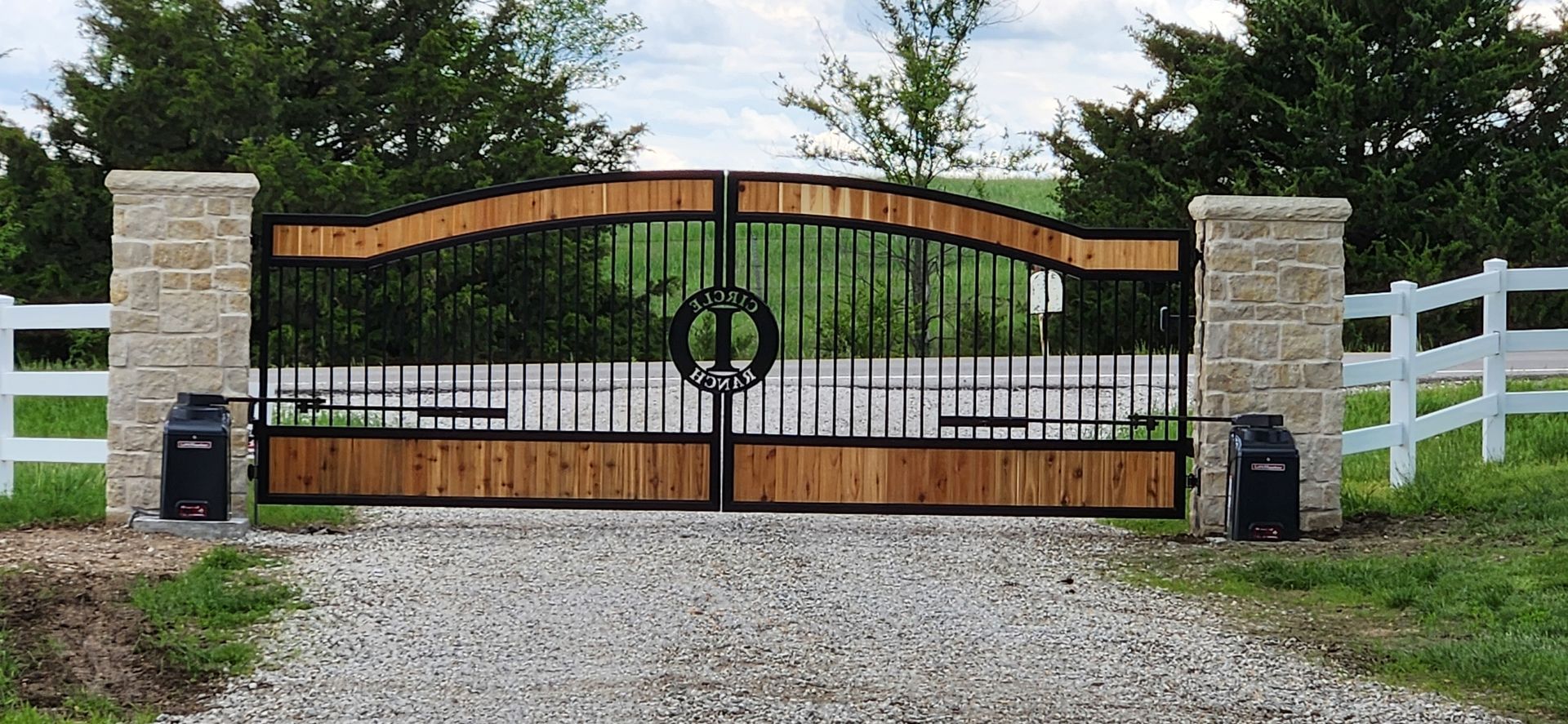 A wrought iron gate with a wreath on it