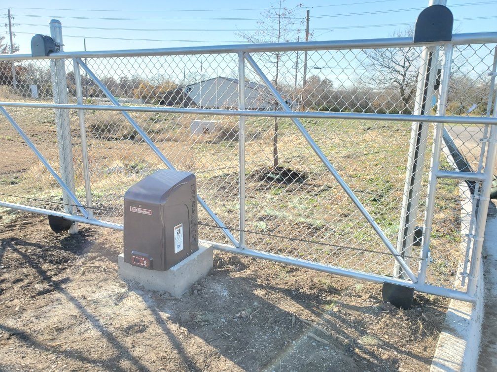 A sliding gate with a motor attached to it.