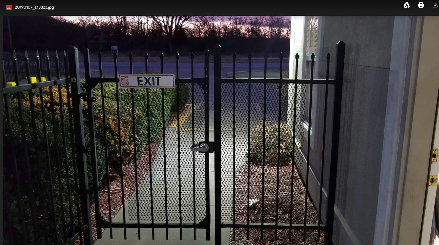 A gate with a sign that says exit on it
