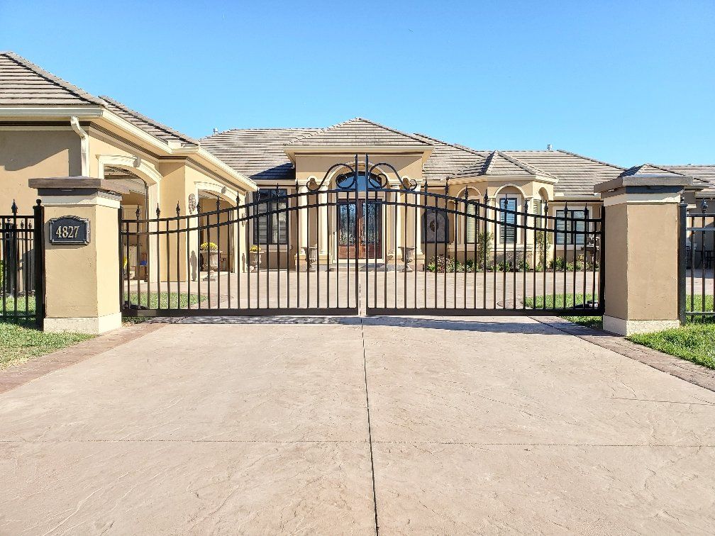 A large house with a gate in front of it