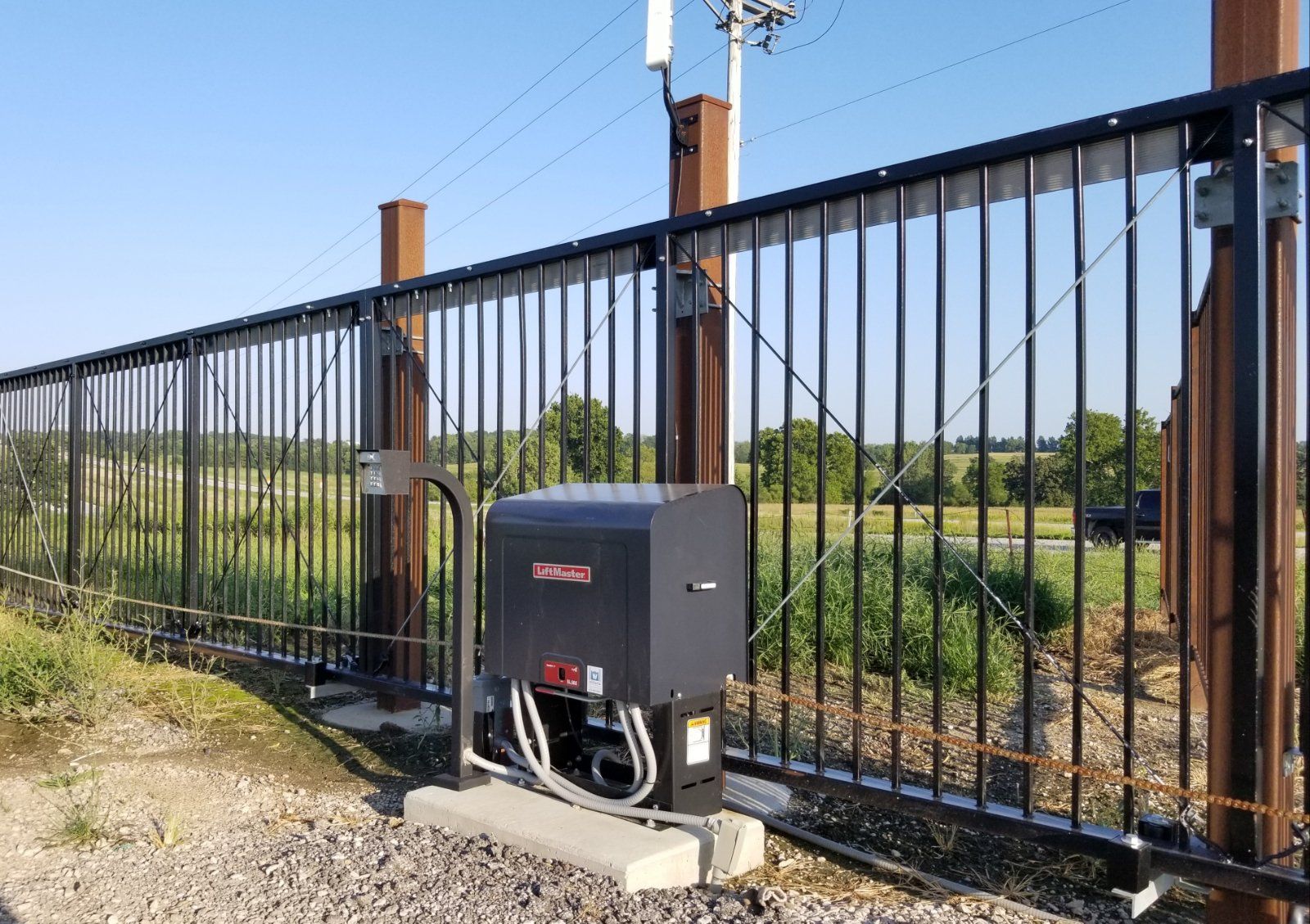 A sliding gate with a motor attached to it.