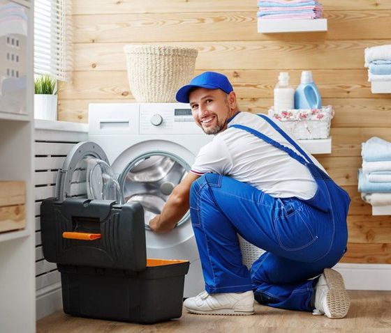 Residential Appliance Repair — Man Repairs Washing Machine in Salem, NH