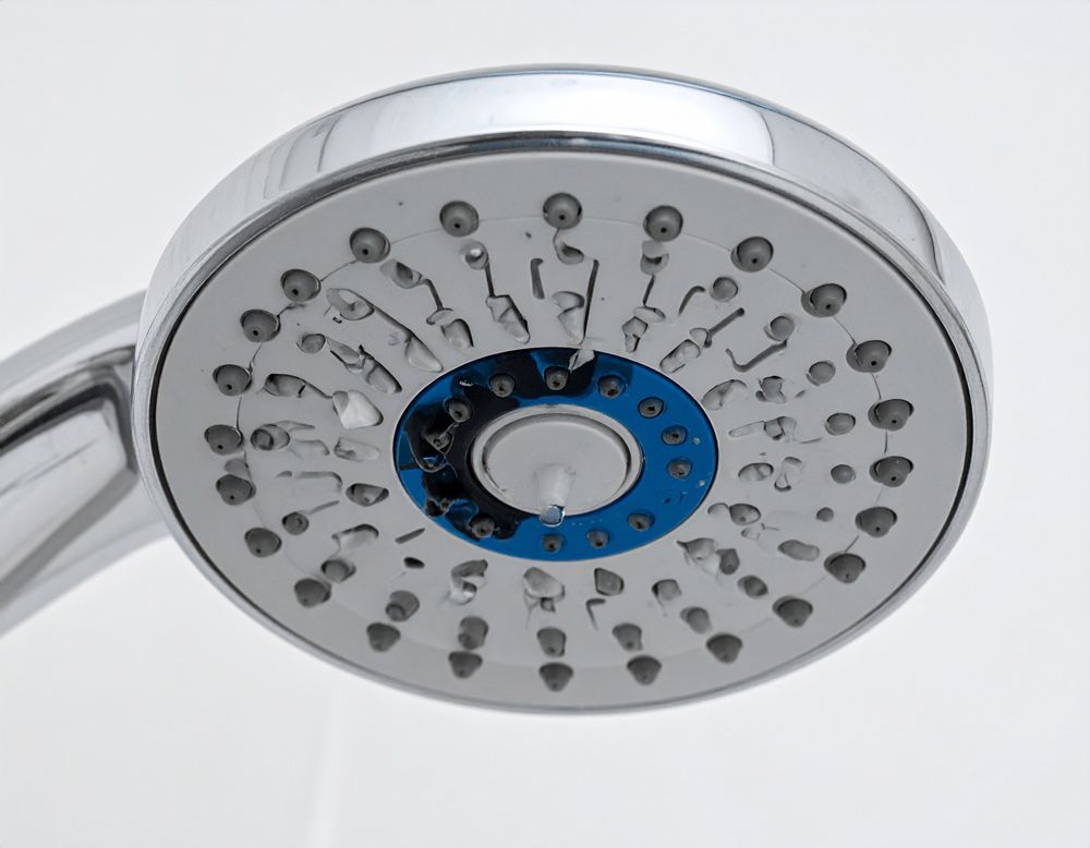 A close up of a showerhead leak in Hayden, Idaho