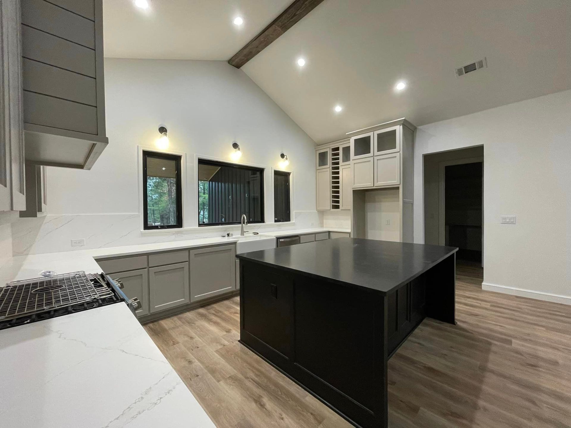 There is a large island in the middle of the kitchen.