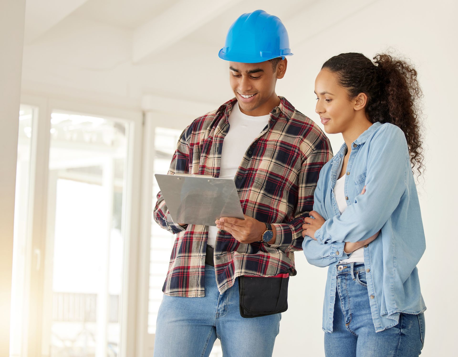 Woman and child doing laundry together, child pouring detergent.