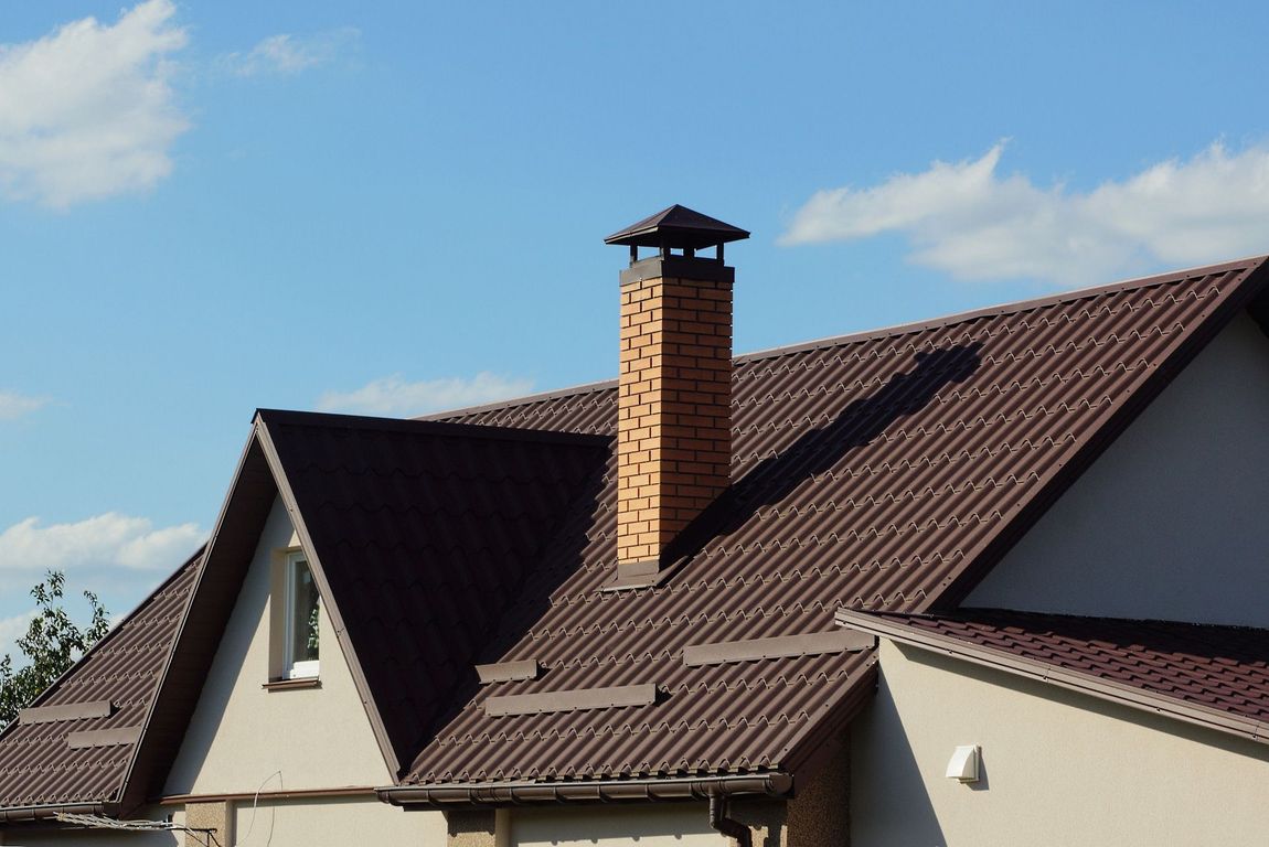 A brown roof with a chimney on top of it