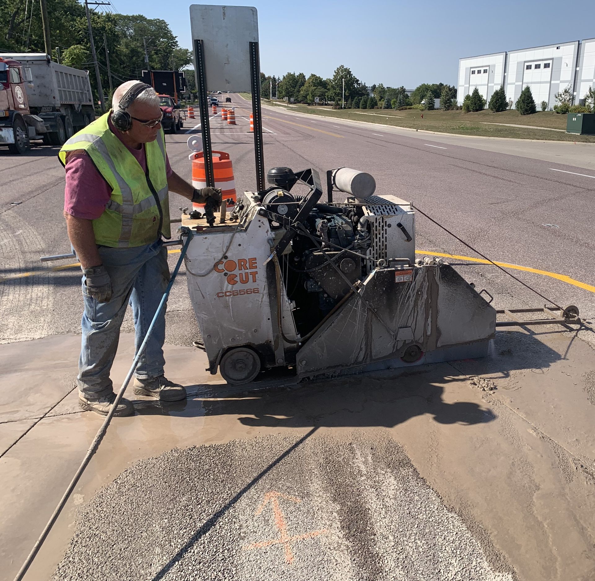 A man is standing next to a machine that says once not
