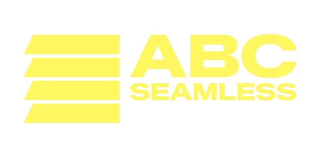 The logo for abc seamless shows a man in a hat pointing up.