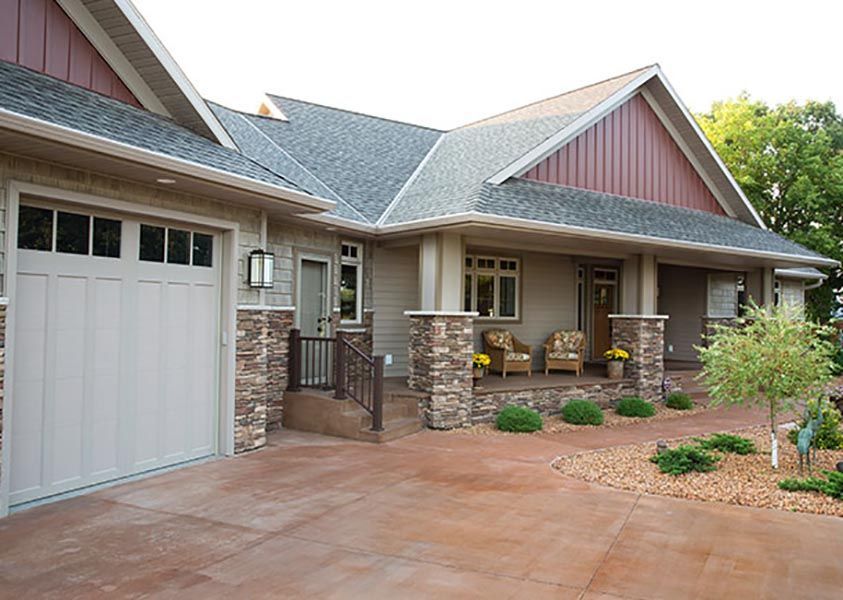 A large house with a garage and a porch