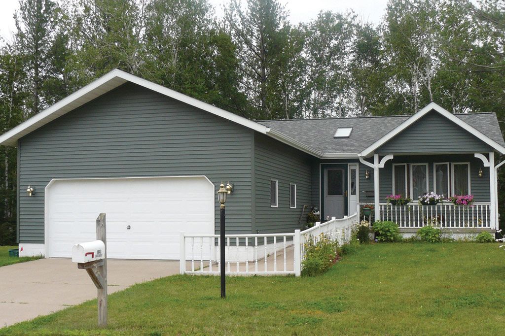 A house with a mailbox in front of it
