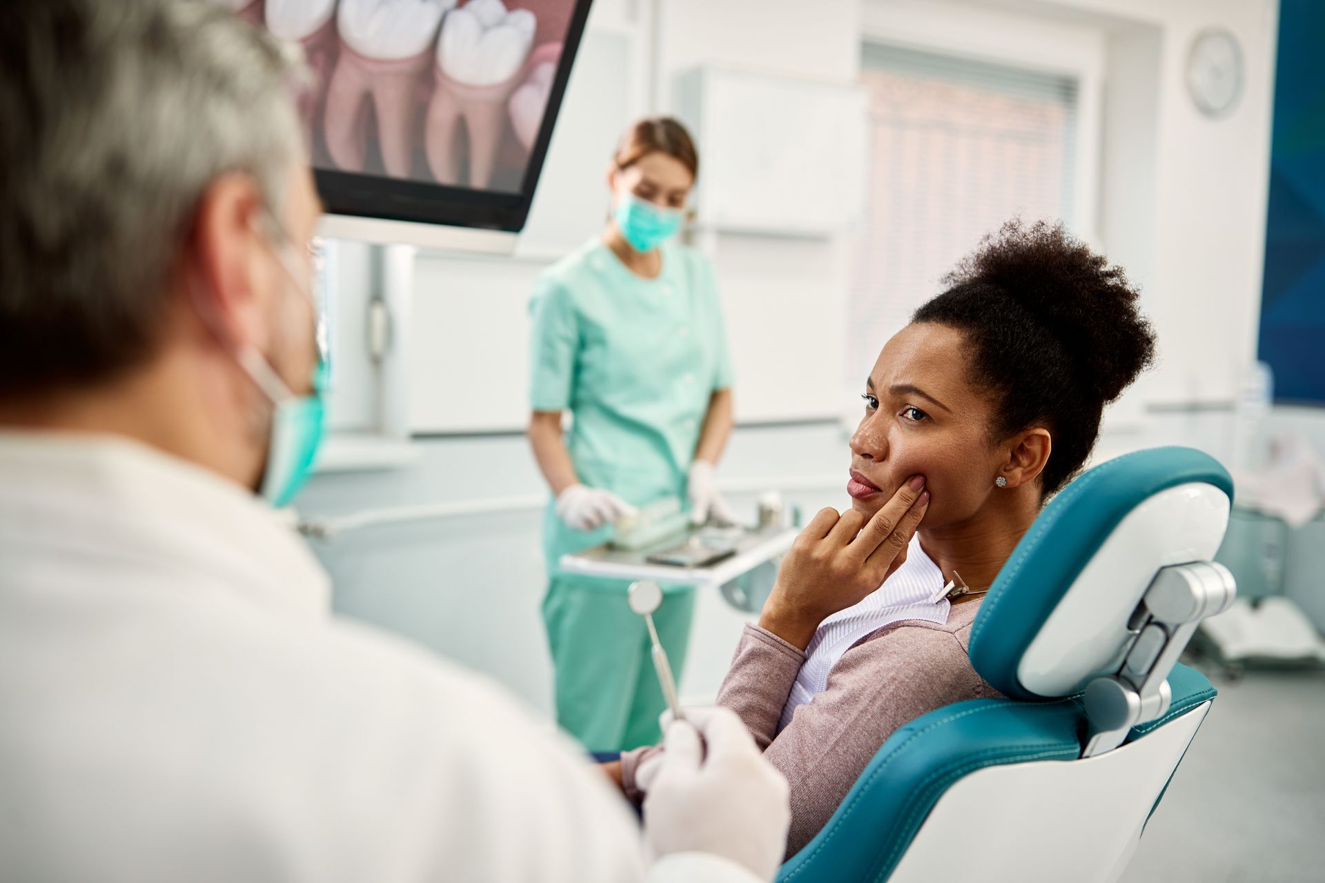 Woman complains of toothache to her dentist.